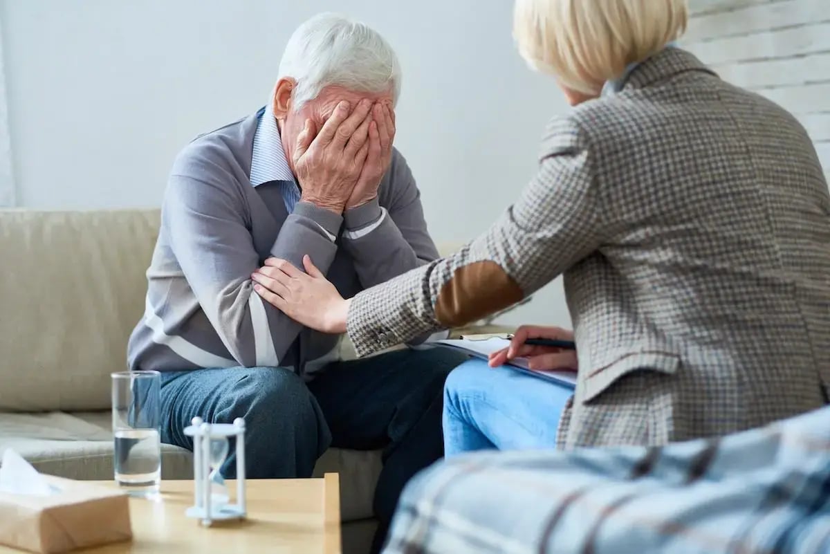 grieving_older_male