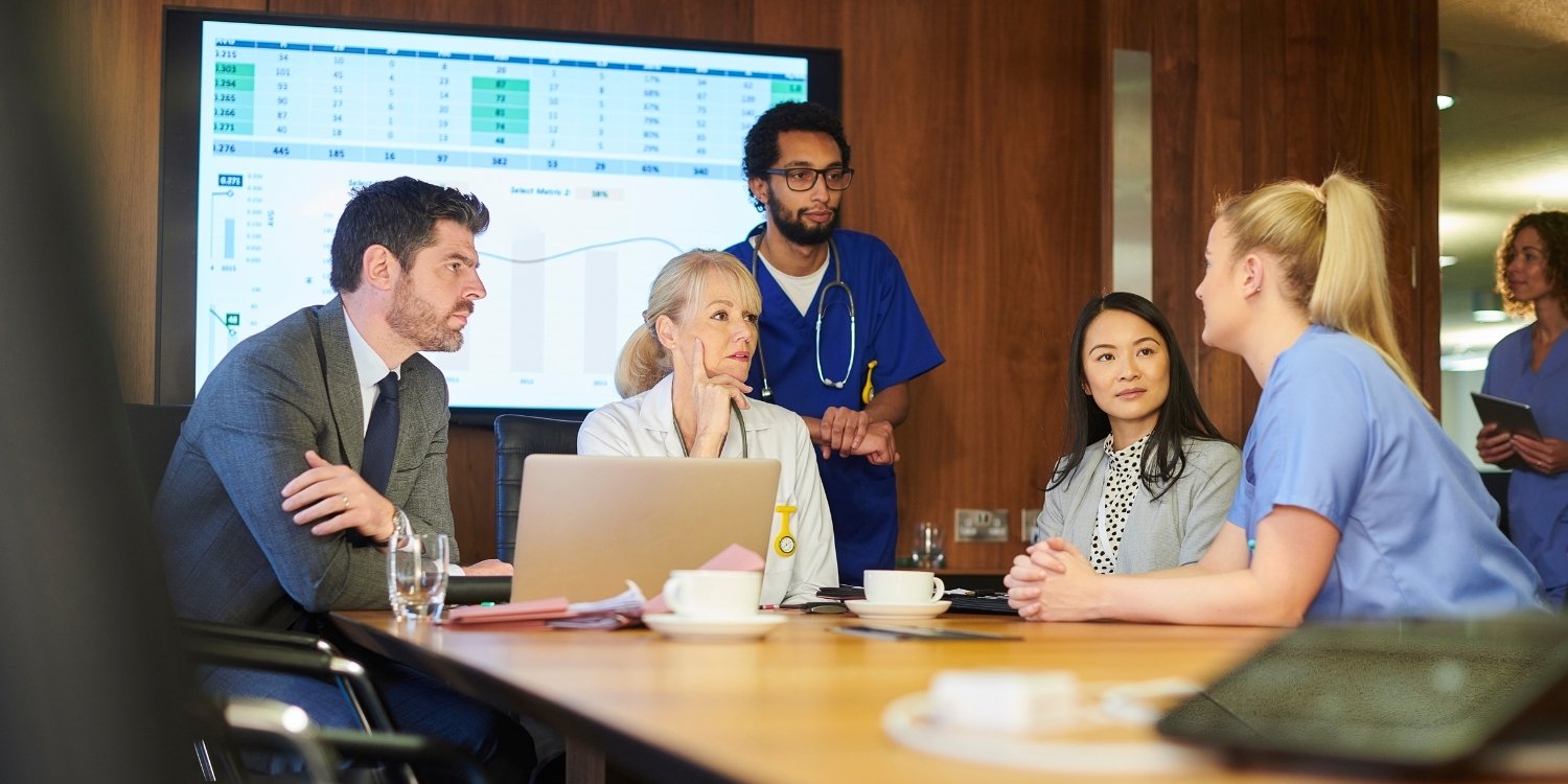 Clinical leaders discussing revenue cycle management