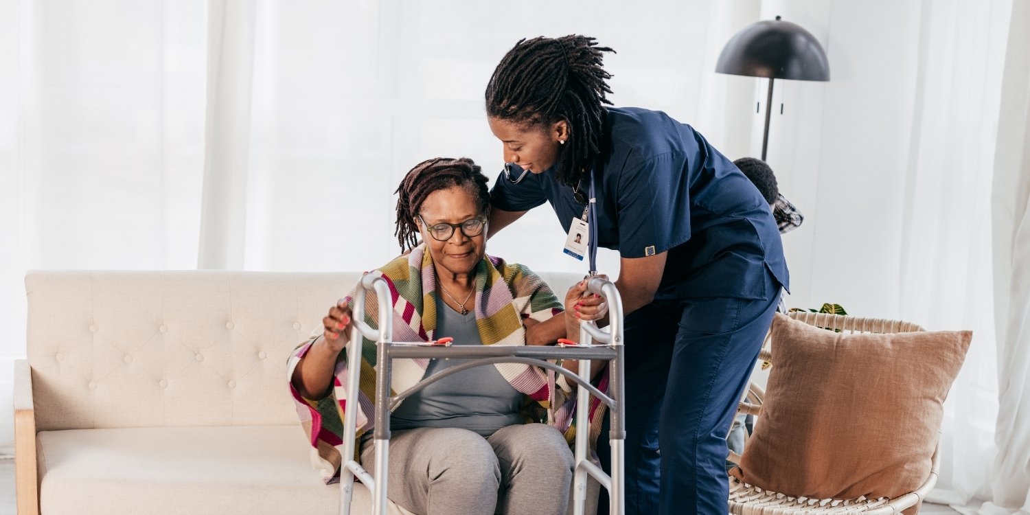 Care-at-home caregiver with elderly patient.